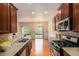 Well-equipped kitchen with stainless steel appliances and a view to the dining area at 3364 Thornbridge Dr # 0, Powder Springs, GA 30127