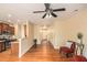 Open-concept living area with hardwood floors flowing into the kitchen and entryway at 3364 Thornbridge Dr # 0, Powder Springs, GA 30127