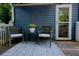 Cozy back deck showcasing comfortable seating and a bright, patterned outdoor rug at 139 Merritt Se St, Marietta, GA 30060