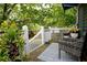 Inviting back deck featuring a seating area with outdoor furniture and mature trees at 139 Merritt Se St, Marietta, GA 30060
