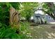 Backyard view with an axe throwing target and a charming home with a welcoming porch and flower boxes at 139 Merritt Se St, Marietta, GA 30060