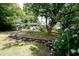 Sprawling backyard featuring a seating area, mature trees, and lush grass at 139 Merritt Se St, Marietta, GA 30060
