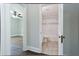 Bathroom access from bedroom showing shower and tile, with hardwood floors in the bedroom at 139 Merritt Se St, Marietta, GA 30060
