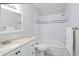 Bright bathroom featuring a vanity with a sink and a shower with white subway tile at 139 Merritt Se St, Marietta, GA 30060