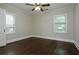 Bedroom features hardwood floors, neutral walls, and two windows providing natural light at 139 Merritt Se St, Marietta, GA 30060