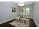 Bright dining room with a glass table, neutral decor, and hardwood flooring at 139 Merritt Se St, Marietta, GA 30060