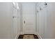 Entryway featuring a white interior door, coat rack with hooks, and dark hardwood flooring at 139 Merritt Se St, Marietta, GA 30060