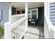 Inviting front porch features a seating area, providing a cozy spot to relax outdoors at 139 Merritt Se St, Marietta, GA 30060