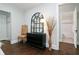 Hallway view featuring a decorative mirror, a chair, and an open doorway to a bathroom at 139 Merritt Se St, Marietta, GA 30060