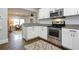 Well-appointed kitchen with white cabinets, stainless steel appliances, and granite countertops at 139 Merritt Se St, Marietta, GA 30060