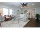 Bright living room with hardwood floors, a cozy sofa, and a view into the bathroom at 139 Merritt Se St, Marietta, GA 30060