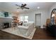 Inviting living room with a decorative fireplace, wood floors, and comfortable seating at 139 Merritt Se St, Marietta, GA 30060