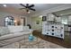 Cozy living room features hardwood floors, ceiling fan, and an open view to the kitchen at 139 Merritt Se St, Marietta, GA 30060