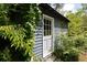 Charming backyard storage shed with a classic design surrounded by greenery at 139 Merritt Se St, Marietta, GA 30060