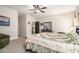 Cozy bedroom with neutral walls, a ceiling fan, and a comfortable seating area at 30 Deer Creek Ct, Moreland, GA 30259