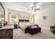 Bright bedroom with neutral walls, a ceiling fan, and two windows letting in plenty of natural light at 30 Deer Creek Ct, Moreland, GA 30259