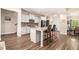 Open-concept kitchen with a large island, stainless steel appliances, and a modern design, perfect for entertaining at 30 Deer Creek Ct, Moreland, GA 30259