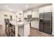 Bright kitchen featuring granite countertops, stainless steel appliances, and a breakfast bar, perfect for casual dining at 30 Deer Creek Ct, Moreland, GA 30259