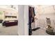Convenient walk-in closet with a view of the bedroom, featuring wire shelving for organized storage at 30 Deer Creek Ct, Moreland, GA 30259