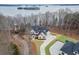 Aerial view of home with private driveway, lake in the background at 7625 Breeze Bay Rd, Cumming, GA 30041