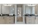 Elegant bathroom with dual vanities, marble countertops, and modern fixtures at 7625 Breeze Bay Rd, Cumming, GA 30041