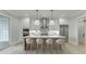 Modern kitchen with marble countertops, stainless steel appliances, and breakfast bar at 7625 Breeze Bay Rd, Cumming, GA 30041