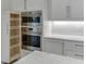 Gourmet kitchen with stainless steel appliances, modern cabinets, and marble countertops at 7625 Breeze Bay Rd, Cumming, GA 30041