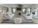 Bright living room with fireplace, modern furniture, and access to outdoor space at 7625 Breeze Bay Rd, Cumming, GA 30041