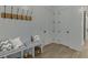 Cozy mud room with built-in bench, storage, and decorative shiplap wall at 7625 Breeze Bay Rd, Cumming, GA 30041