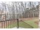 View of the lake through bare trees from an outdoor patio at 7625 Breeze Bay Rd, Cumming, GA 30041