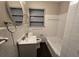 Bathroom featuring updated fixtures, tub, and tiled walls at 767 Vinson Pl, Atlanta, GA 30315