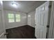 Bright bedroom showcasing hardwood floors, neutral walls, and bright windows at 767 Vinson Pl, Atlanta, GA 30315
