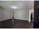 Comfortable living room featuring hardwood floors, neutral walls, and bright windows at 767 Vinson Pl, Atlanta, GA 30315