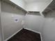 Spacious walk-in closet with wooden floors, bright lighting, and shelving for maximum storage at 767 Vinson Pl, Atlanta, GA 30315
