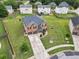 Aerial view of a two-story brick home with a well-manicured lawn at 85 Foxgrove Cv, Covington, GA 30014