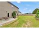 Wide backyard with a patio and a fire pit perfect for relaxing at 85 Foxgrove Cv, Covington, GA 30014