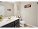 A powder bathroom featuring an under-mount sink, neutral walls, and tile flooring at 85 Foxgrove Cv, Covington, GA 30014