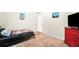 Bedroom with neutral colored walls and carpet flooring with a flat screen TV at 85 Foxgrove Cv, Covington, GA 30014