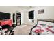 Bedroom featuring an accent wall, TV, desk and comfy-looking bed at 85 Foxgrove Cv, Covington, GA 30014