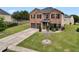 Charming two-story brick home with a well-manicured lawn and a two-car garage at 85 Foxgrove Cv, Covington, GA 30014