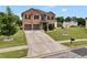Charming two-story brick home with a well-manicured lawn and a two-car garage at 85 Foxgrove Cv, Covington, GA 30014