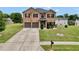 Charming two-story brick home with a well-manicured lawn and a two-car garage at 85 Foxgrove Cv, Covington, GA 30014