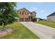 Lovely two-story home boasting a brick facade, well-manicured lawn, and an attached two-car garage at 85 Foxgrove Cv, Covington, GA 30014