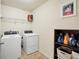 Bright laundry room with modern appliances and ample storage space at 85 Foxgrove Cv, Covington, GA 30014