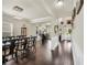 Spacious area showcasing the dining room, bar area, and hardwood floors, creating an inviting atmosphere at 85 Foxgrove Cv, Covington, GA 30014