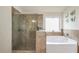 Luxurious bathroom featuring a separate shower and soaking tub with tile surround at 85 Foxgrove Cv, Covington, GA 30014