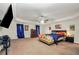Spacious primary bedroom with carpet and tray ceiling plus lots of natural light at 85 Foxgrove Cv, Covington, GA 30014
