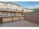 Deck with a wooden fence, showcasing a view of the townhome exteriors and patios at , Atlanta, GA 30318