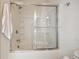 Modern bathroom with sliding glass shower doors and a soaking tub at , Atlanta, GA 30318