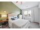 Inviting bedroom with a large window, ceiling fan, and neutral decor at , Atlanta, GA 30318
